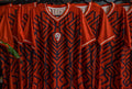 Omm red jersey